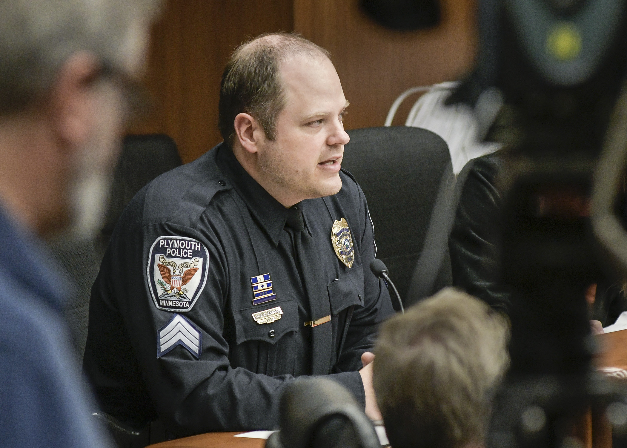 Erik Fadden, a protective policing sergeant with the Plymouth Police Department, testifies before the House Health and Human Services Finance Committee March 29. Photo by Paul Battaglia